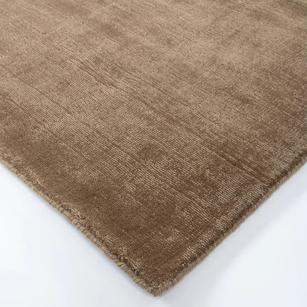 Brown textured rug on a white background